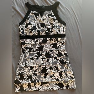 very slimming   this dress fits more like a size 3/4